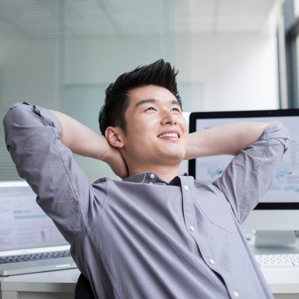 Young businessman thinking in office